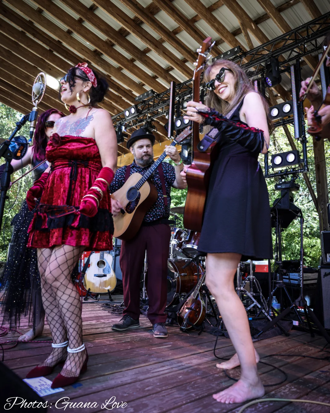 Jenny and the band sharing an outdoor festival stage